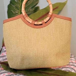 Lime green woven purse with bamboo handles.